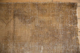 Distressed Afshar rug reverse, showing hand-knotted foundation texture with natural tones.