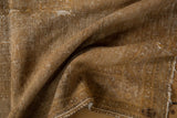 Distressed vintage Afshar rug showcasing its textural worn pile and visible foundation.