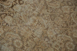Even wear across the distressed Tabriz rug's pile showing visible knot heads.