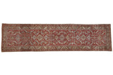 Distressed vintage Heriz runner with allover Herati motif in brick red and beige tones.