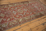 Textured pile of vintage distressed Heriz runner with Herati motif, brick red, and powder blue.