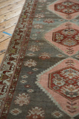 Distressed vintage Malayer runner's wine red geometric side border and abrashed field.