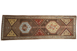 1930s vintage Northwest Persian runner rug, geometric medallions in soft brown, red, blue, and saffron, 3'6