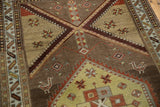Distressed Northwest Persian runner: stylized birds, geometric patterns in saffron and wine.