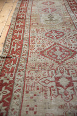 Angled view of a vintage Karaja runner highlighting its length and softly distressed texture.