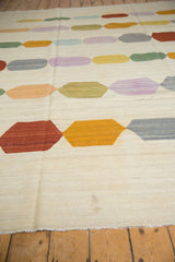 Fringed end and flat weave texture of a new Afghani Kilim carpet.
