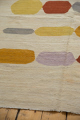 Hand woven Afghani Kilim texture with abstract yellow, terracotta, and lilac pebble shapes.