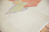 Ivory, lavender, brick red abstract flatweave with abrashes and side cord selvage.