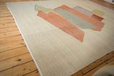 Hand-woven Afghani Kilim displaying ivory and beige abrashes on its textured field.