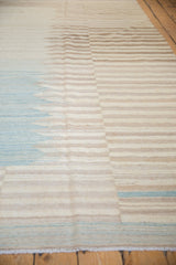 Afghani Kilim rug fringe, with serrated ivory and pale blue horizontal bands.