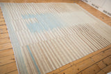 Geometric kilim edge with ivory, coffee, blue banded pattern and original selvage.
