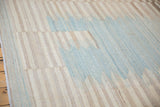 Staggered, serrated blue and ivory banded pattern on an Afghani Kilim.