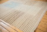 Original side cord selvage and banded ivory, coffee brown pattern on the Afghani Kilim.