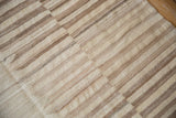 Hand woven Afghani Kilim texture with ivory and coffee brown staggered bands.