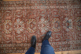 Looking down at the vintage Karaja runner's distressed texture and allover pattern to show scale.