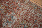 Evenly worn pile of a vintage Karaja runner showing detailed red and blue splayed palmettes.
