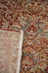 Hand-knotted back, secured side cord, and ivory fringe on a vintage Persian Karaja rug.