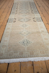 Faded beige diamond patterns and textured pile of a distressed Serab runner.