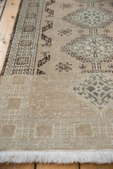 Distressed Serab runner end with fringe, showing even wear and faint foundation in beige and teal.