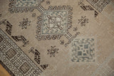Distressed Serab runner with geometric dusty teal hook-and-latch diamond medallion.
