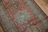 Distressed vintage Heriz runner: mint geometric medallion with serrated perimeter.