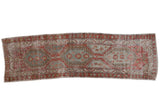 Vintage distressed Heriz runner with triple geometric medallions in faded cherry red and powder blue.