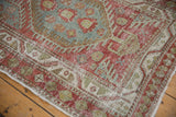 Distressed texture and pinwheel border designs on a vintage Heriz rug runner.