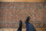 Antique distressed Bakshaish runner with faded ruby red, dusty gold Herati motif, and abrashes.