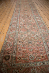 Distressed Bakshaish runner's pile with fantastic abrashes, pale ruby red, and ivory Herati motif.
