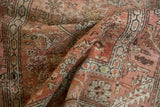 Antique Bakshaish runner's distressed pile, revealing blush, dusty gold Herati motif with foundation showing.