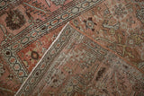 Distressed antique Bakshaish rug pile showing foundation, Herati motif, and pale blush abrashes.