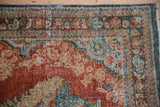 Distressed Mahal runner with Rococo floral pattern in brick red, dusty teal, and beige tones.
