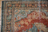 Vintage Mahal runner's distressed brick red and teal pile showing foundation.