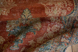 Vintage distressed Mahal runner pile with brick red, dusty teal, and gold ornate motifs.