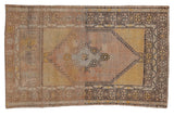 Distressed Oushak rug, pale pink and saffron yellow floral medallion, starburst border, 2'8