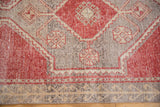 Textured Vintage Oushak runner border, germinating plant motifs, red, ivory, and silver.