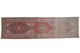 Vintage distressed Anatolian runner with a series of medallions in red and charcoal that fade to pale silver.