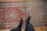 Overhead view showing the scale of the distressed Anatolian runner's contrasting medallion patterns.