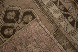 Distressed Oushak runner corner showing muted pile and distinct hand-knotted foundation.
