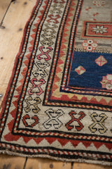 Crab style and zigzag geometric borders on a vintage Caucasian runner with even, low pile.