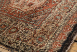 Thick plush pile with rust, ivory, and blue abrash on the vintage Tulu rug.