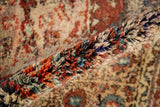 Folded vintage Tulu rug edge, revealing plush pile with a rainbow-like color effect.
