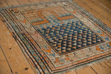 Vintage Caucasian rug with tangerine Mehrab, triangular field pattern, and vibrant abrashes.