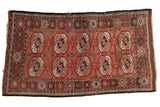 Vintage Afghani Bokhara hand-knotted rug with madder red guls, brown and navy accents.