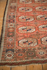 Vintage Afghani Bokhara rug side showing madder red border, intact goat hair selvage, and fringe.