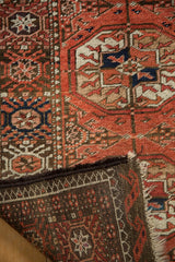 Vintage Afghani Bokhara rug's madder red pile, dark brown goat hair selvage, and woven foundation.