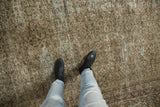 Walk-on view of the distressed vintage Mahal carpet, showing subtle Herati pattern and earthy tones.