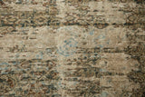 Distressed Mahal carpet's worn texture, revealing nuanced Herati pattern and ivory, brown, sage tones.