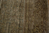 Textured pile of a distressed Mahal carpet, with subtle Herati motif, olive, brown, and ivory tones.