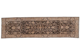 Vintage distressed Sparta rug runner with scrolling beige vinery and blossoms on a dark charcoal field.